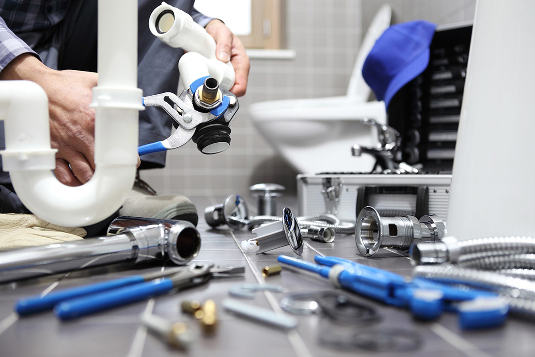 Plumbers in Haddonfield Plumber repairing bathroom plumbing